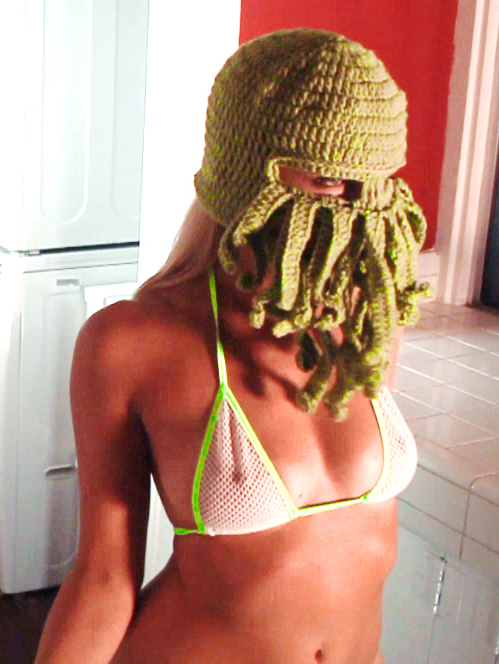 Brooke Marks in a green Cthulhu mask